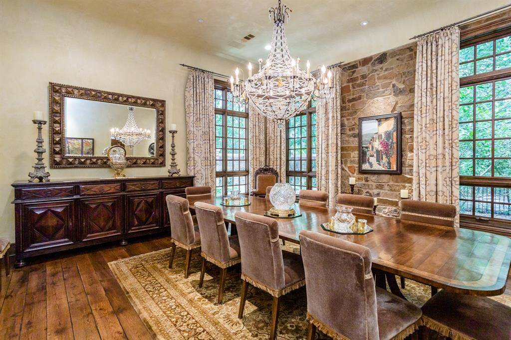 Spacious dining room with white oak hardwood floors, plenty of windows and exposed stone wall.  Butler pantry provides private access to kitchen.
