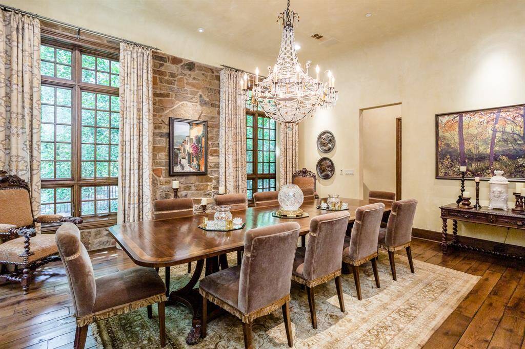 Spacious dining room with hardwood floors, plenty of windows and exposed stone wall.  Butler pantry provides private access to kitchen.