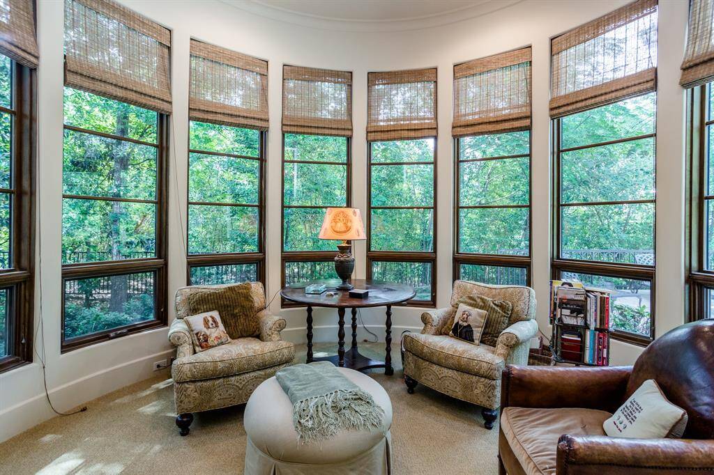 Private sitting area or work out area off of Primary Bath. Secluded in the trees.