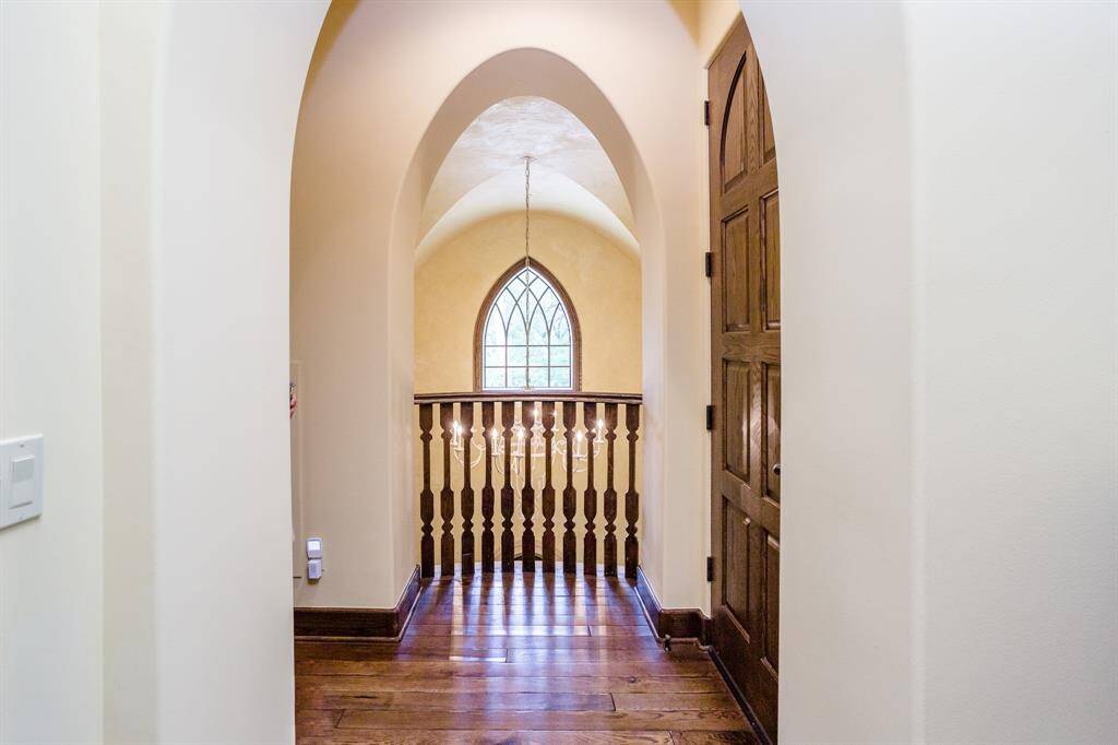 Second floor hallway leading to two of three bedroom suites.