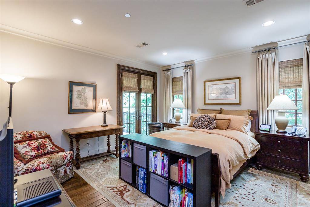 One of three second floor private bedrooms with en-suite full bath.  White oak hardwood floors.  Recessed lighting.  Private balcony.