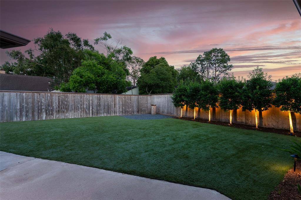 Custom landscape lighting sets the perfect vibe for evenings of relaxation or fun.