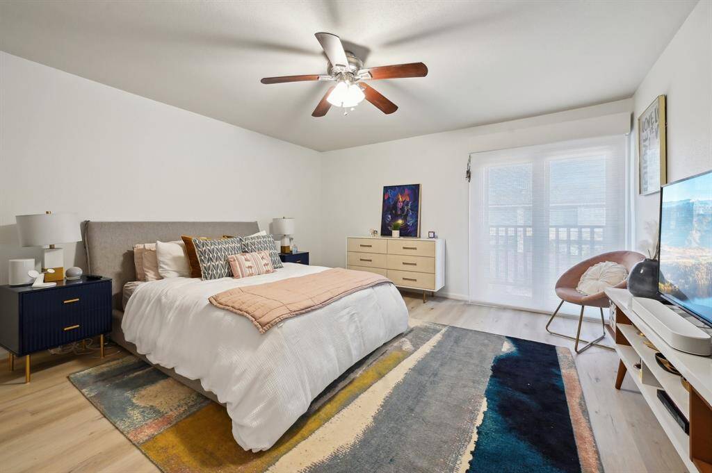 Primary Bedroom- walk out into your balcony through your soundproof sliding doors that overlooks the Briar Club, motorized solar shades