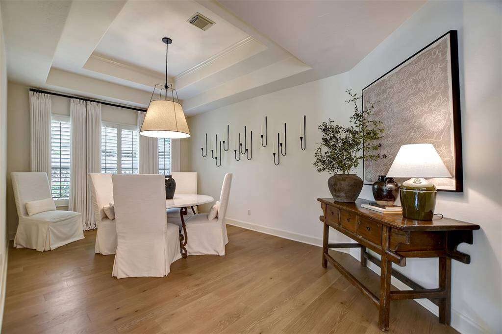 Elegant formal dining room with ample natural light, perfect for hosting memorable gatherings.