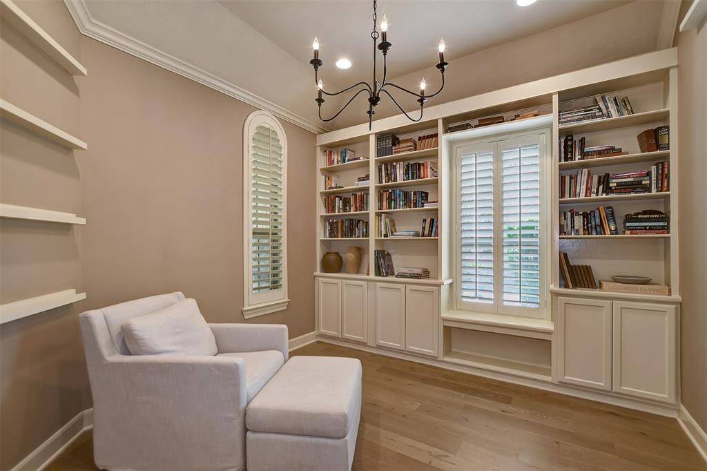 Charming study with elegant built-in bookshelves and a cozy reading nook, perfect for work or relaxation.