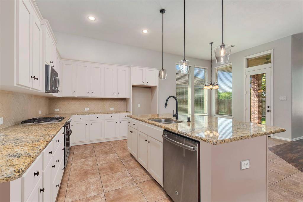 Virtually altered cabinet color to show how the kitchen looks with painted cabinets!