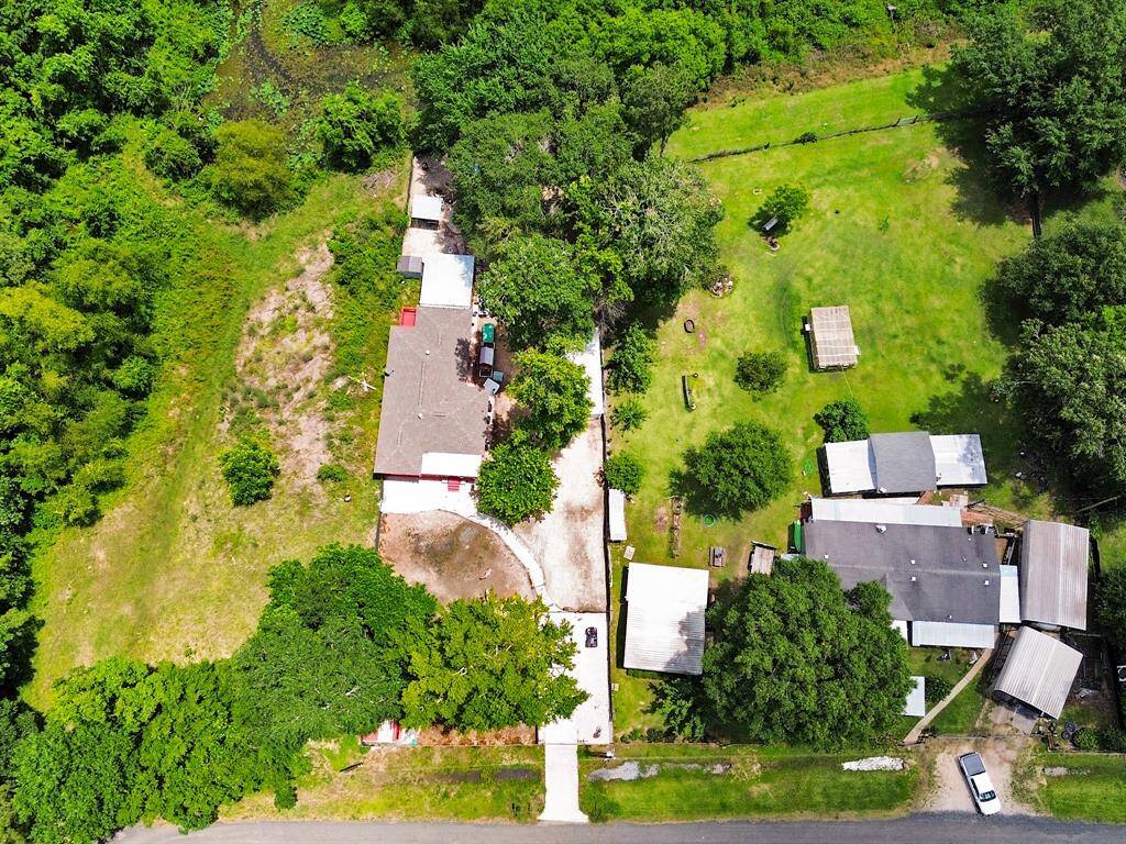 This top-down view outlines the full 0.43-acre property, nestled within a wooded landscape that includes lake access. You have the option to build a private dock for fishing, kayaking, or launching small boats—making the most of this scenic location.