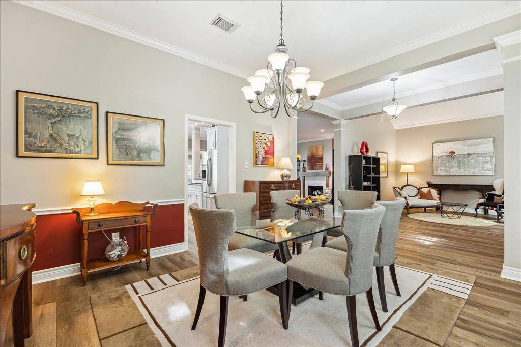 We are looking through the formal dining area into the formal living and the family room beyond. You can have a massive table here if you entertain large groups.