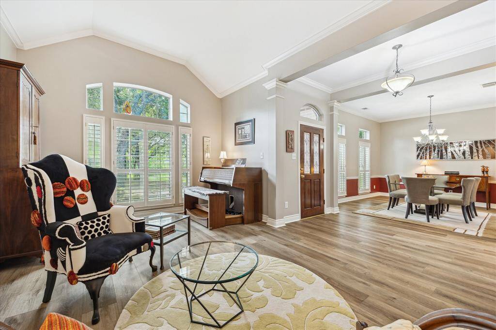 This shows the perspective from the formal living room, looking through the entry and into the formal dining room.