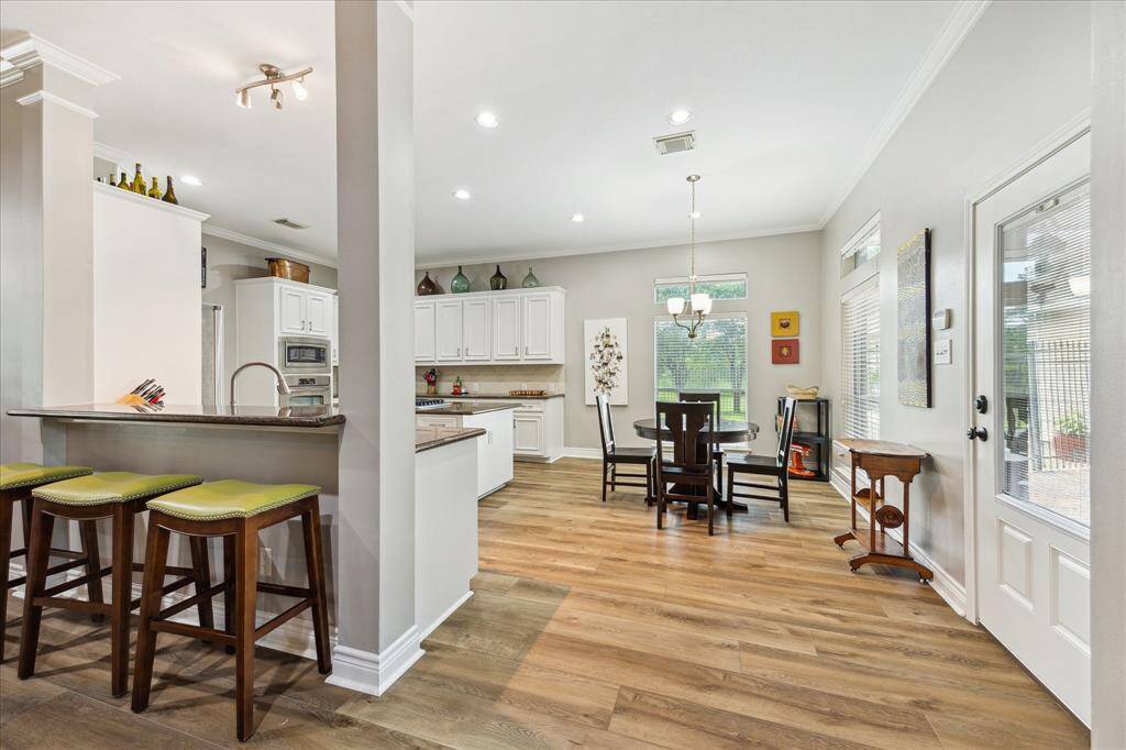 You have a breakfast bar, a spacious breakfast room and a kitchen you will love working in. The back door leads to the covered patio and garage.