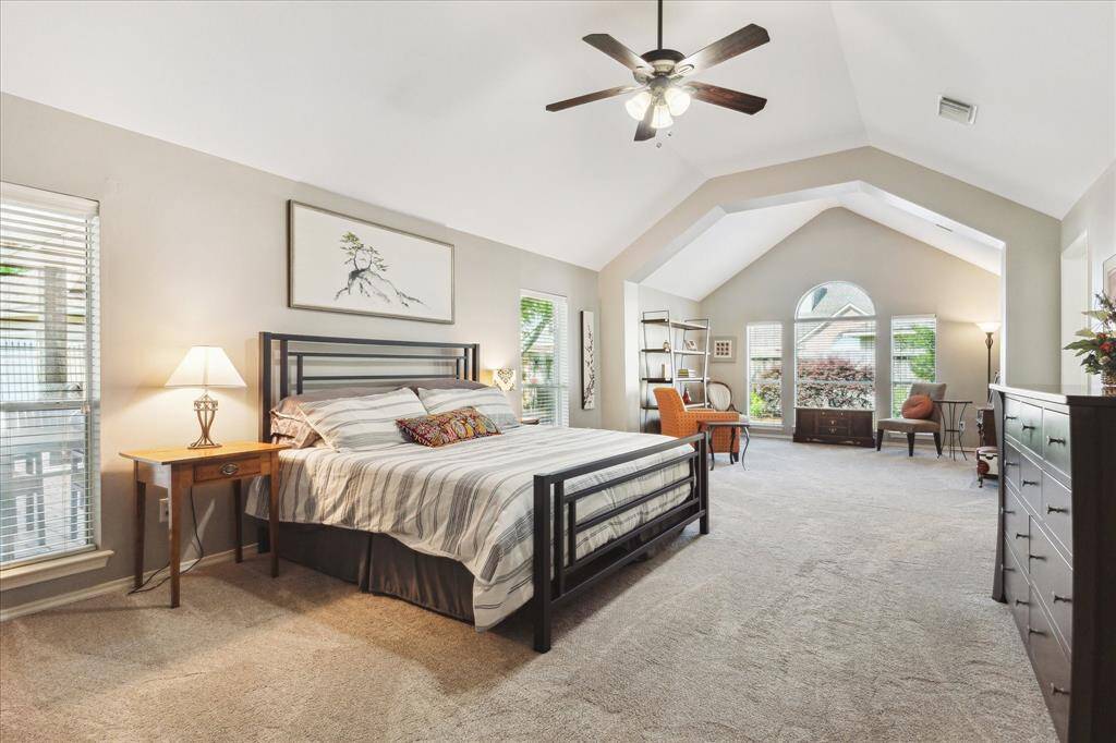 The primary suite is at the rear of the house, adjacent to the covered patio. You have a large bedroom area with plenty of space for oversized furnishings, and an attached sitting area. This would make an ideal home office, exercise room, nursery, or just a quiet space for reading or playing music.