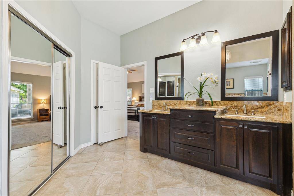 There's a large closet that hides behind the mirrored doors. You can see the dual vanity. The linen closet is behind the door.