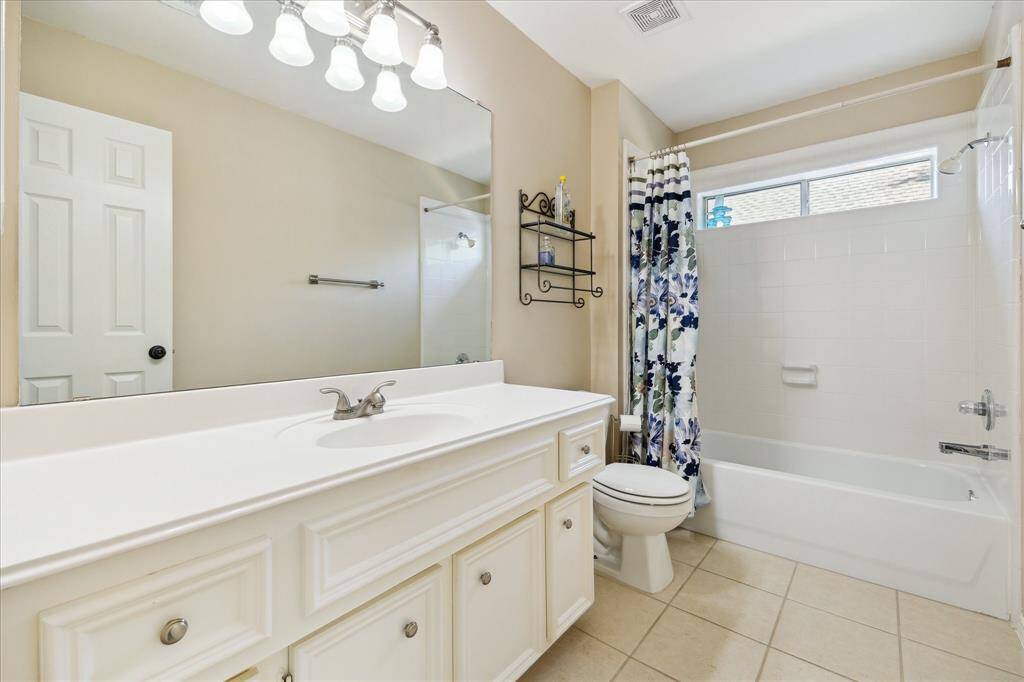 Here's the hall bath that serves the front bedroom and your guests. The middle bedroom occupants could also use this one.