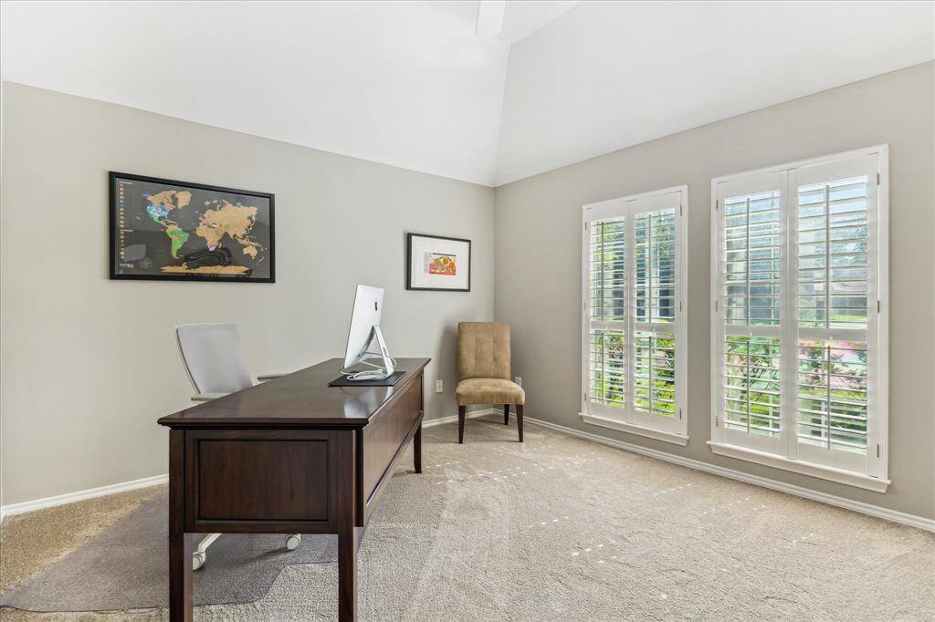 The front bedroom is currently being used as an office because it has the best natural light and views of the outdoors. It has a coffered ceiling.