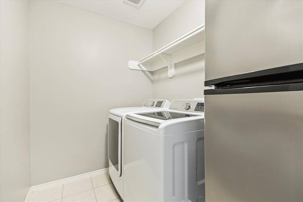 Your laundry room has electric dryer connections. It would not be too hard to add gas. There's room for an extra fridge and there's a coat closet directly across the hall. These appliances will stay.