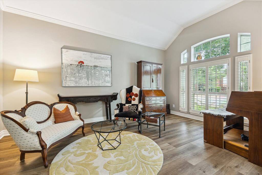 The formal living room is being used as a music room now. It's to your right as you enter. Note the view through the plantation shutters. You have your own little park.