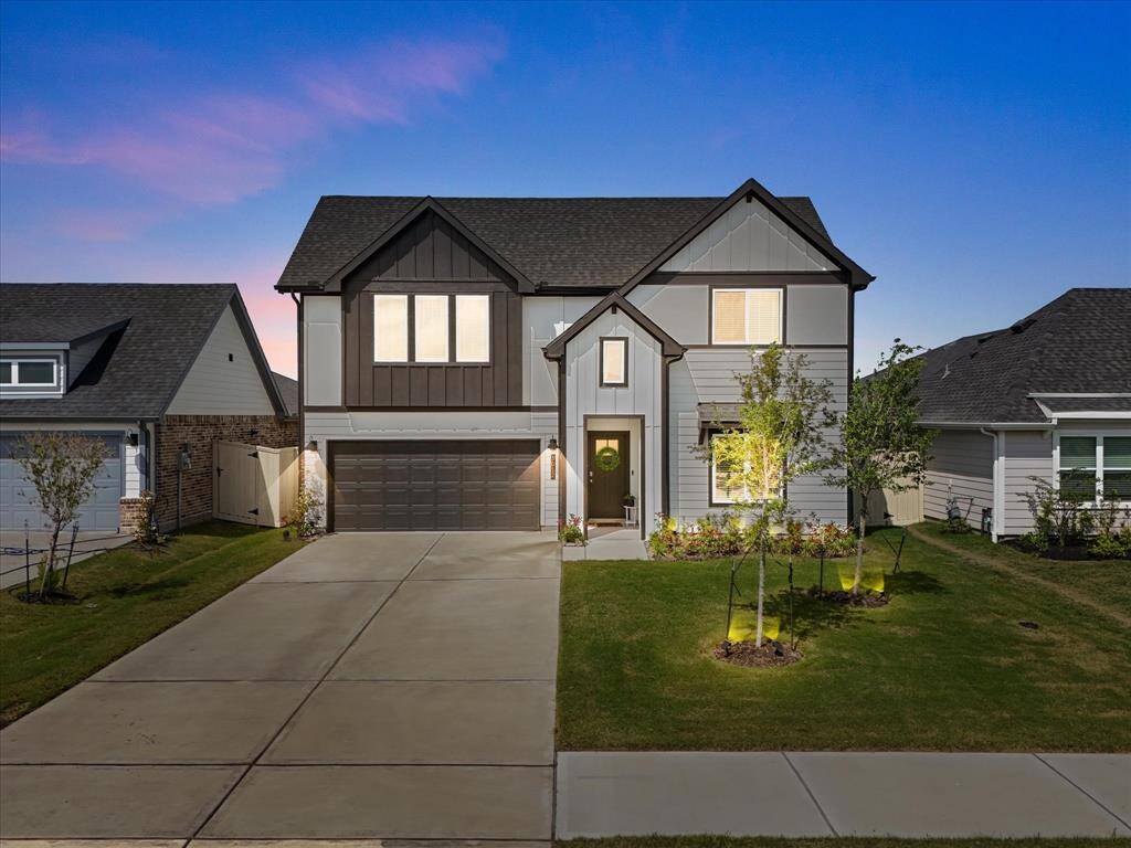 Black and white two-story farm house stunner with no rear neighbors