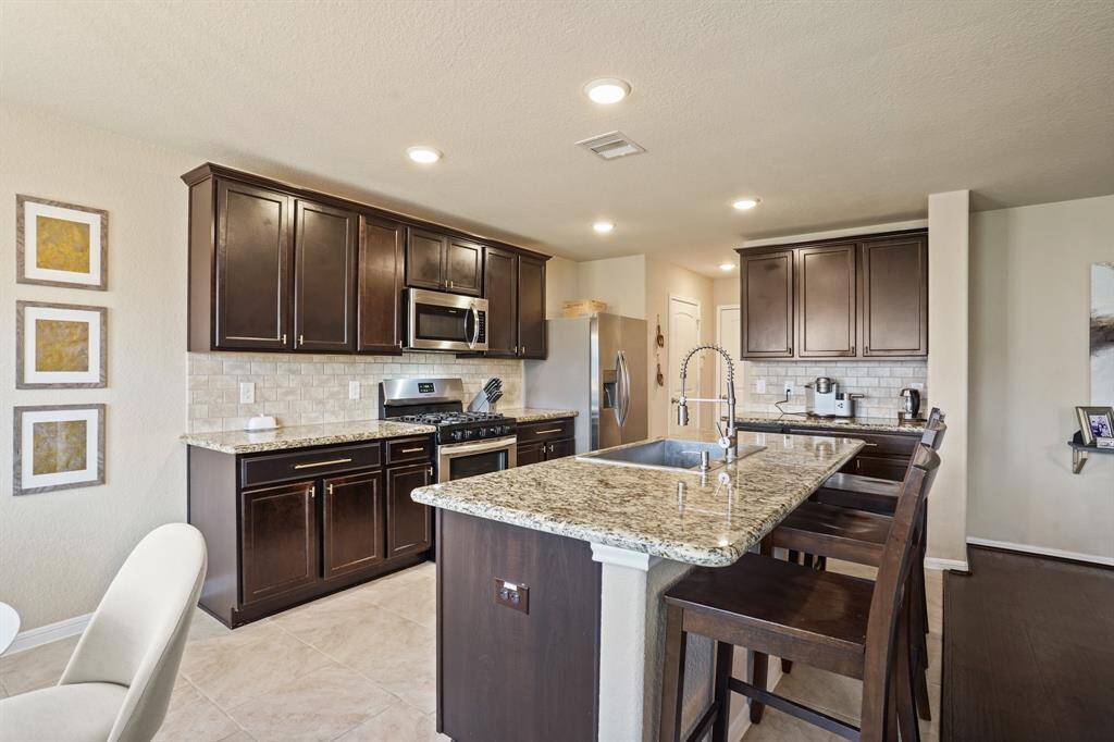 Designer kitchen with stainless steel appliances