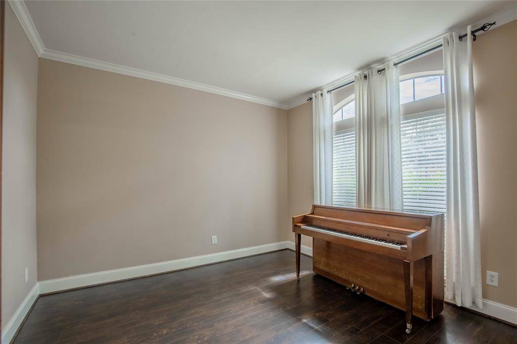 An inviting study with large windows, perfect for productivity and creativity.