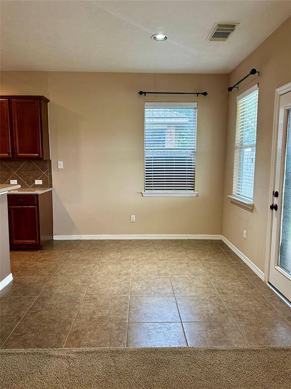 Breakfast area conveniently located next to the kitchen, family room, and access to the backyard patio