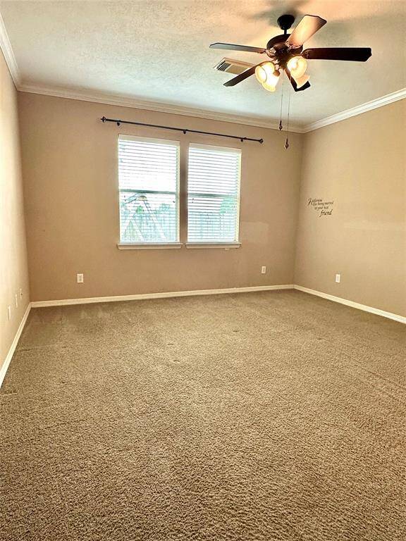 Primary bedroom with ceiling fan