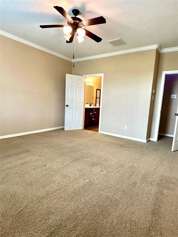 Primary bedroom with ceiling fan