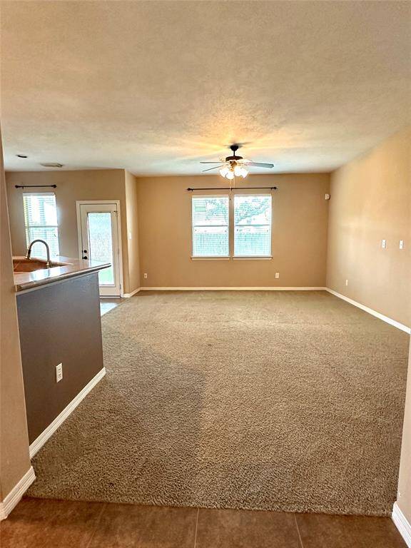 Enjoy some family time in the back room next to the kitchen and breakfast area
