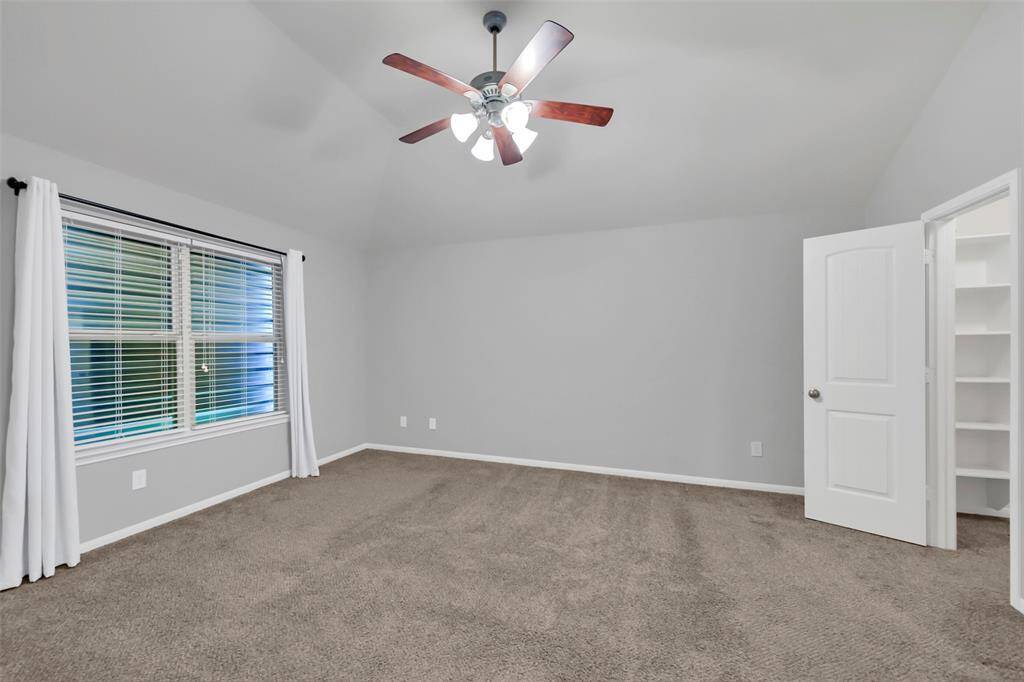 The metal shutter over the outside of the window has been removed, but conveys with the home for extra protection from storms.