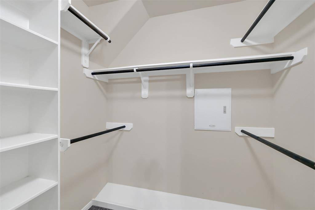 Walk-in closet with fabulous built-ins.