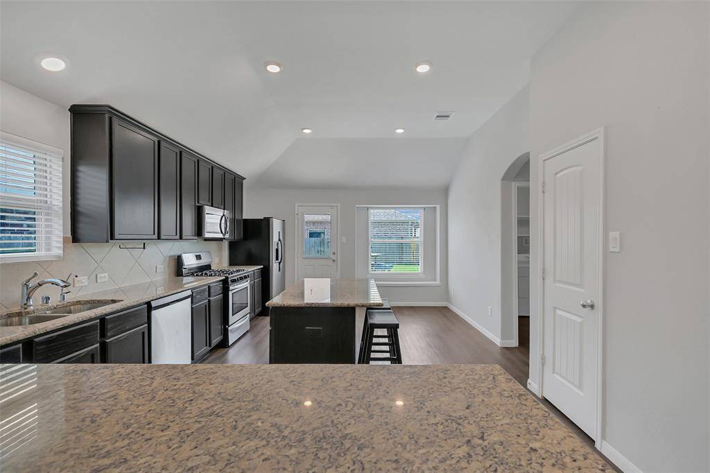So much sparkling granite counter space making meal prep a breeze.