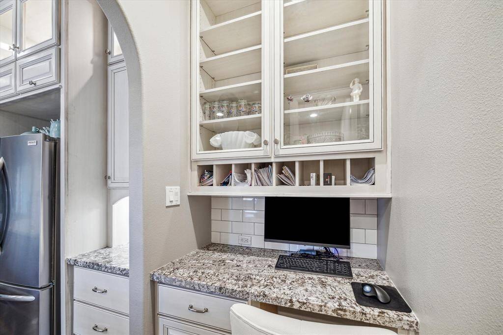 Built in desk with additional drawers and cabinets.