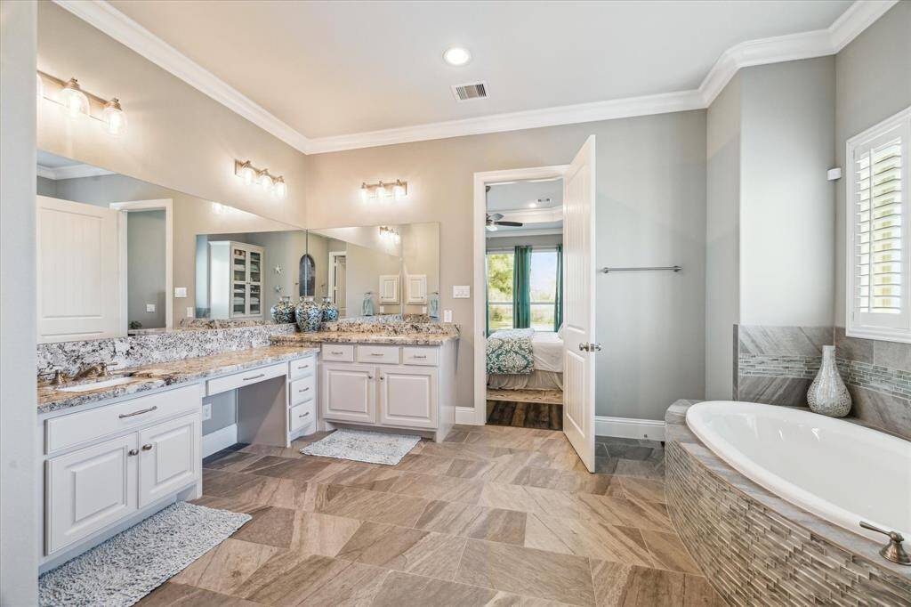 Double sinks along with built in makeup counter.