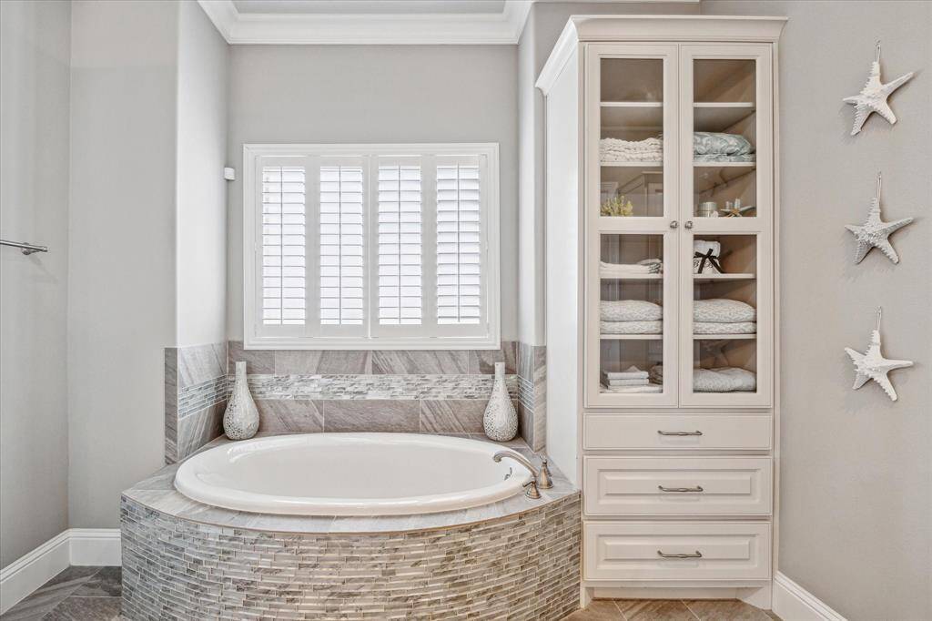 Large soaking tub and a separate walk in shower with standard and rain shower heads.