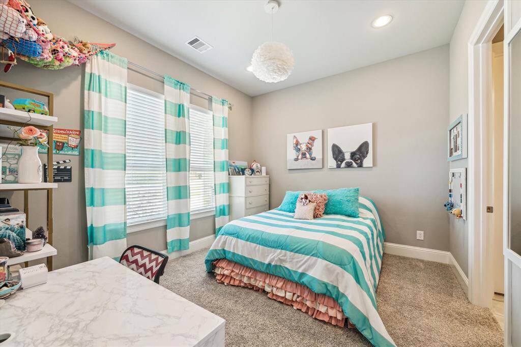Guest Bedroom located on the first floor with it's own en suite bathroom and walk in closet.