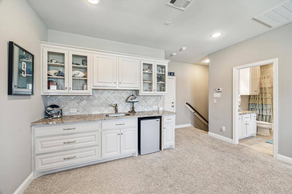 Built in cabinets and wet bar.