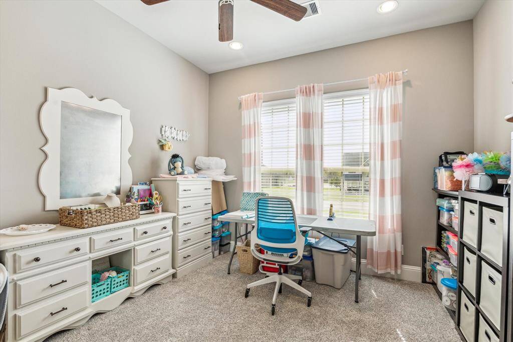 This guest bedroom is currently being used as a craft room. Connected to shared bathroom on first floor with it's own vanity.