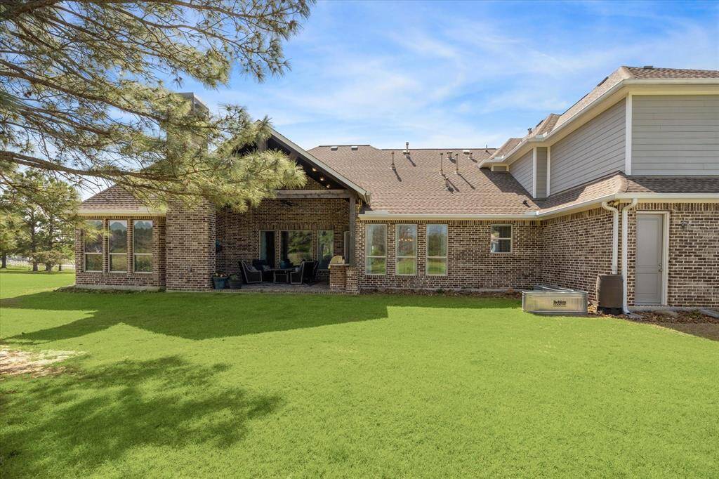 Private back yard with covered patio.