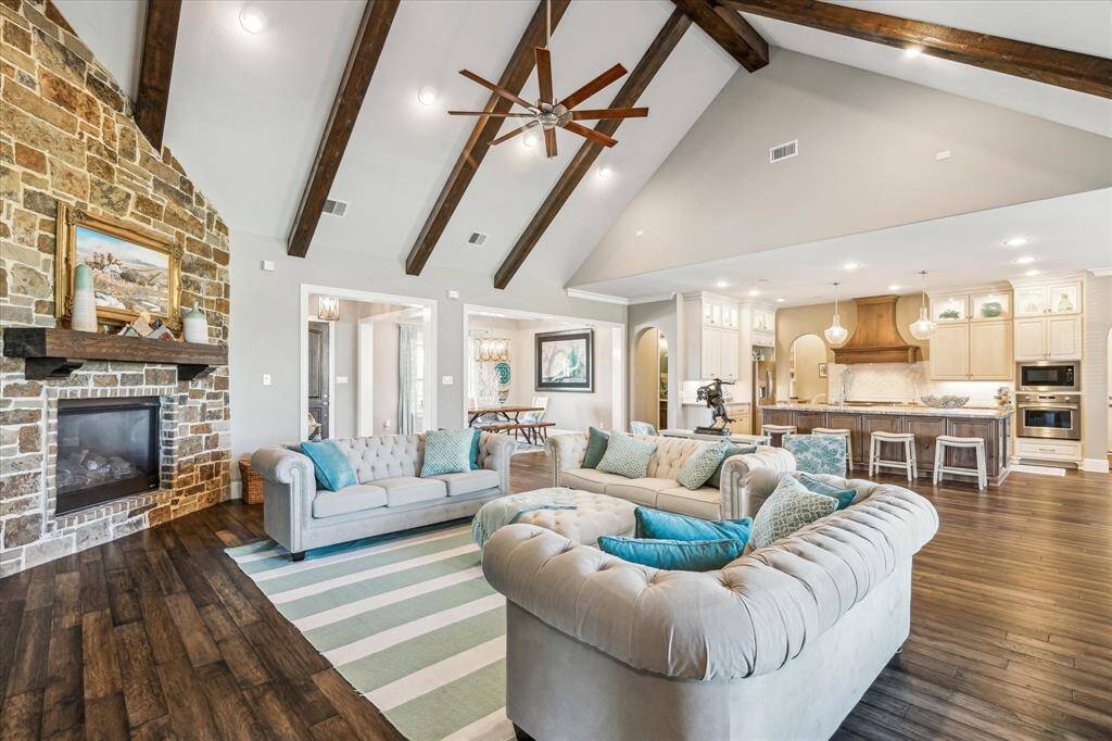 Floor to ceiling stone gas fireplace.