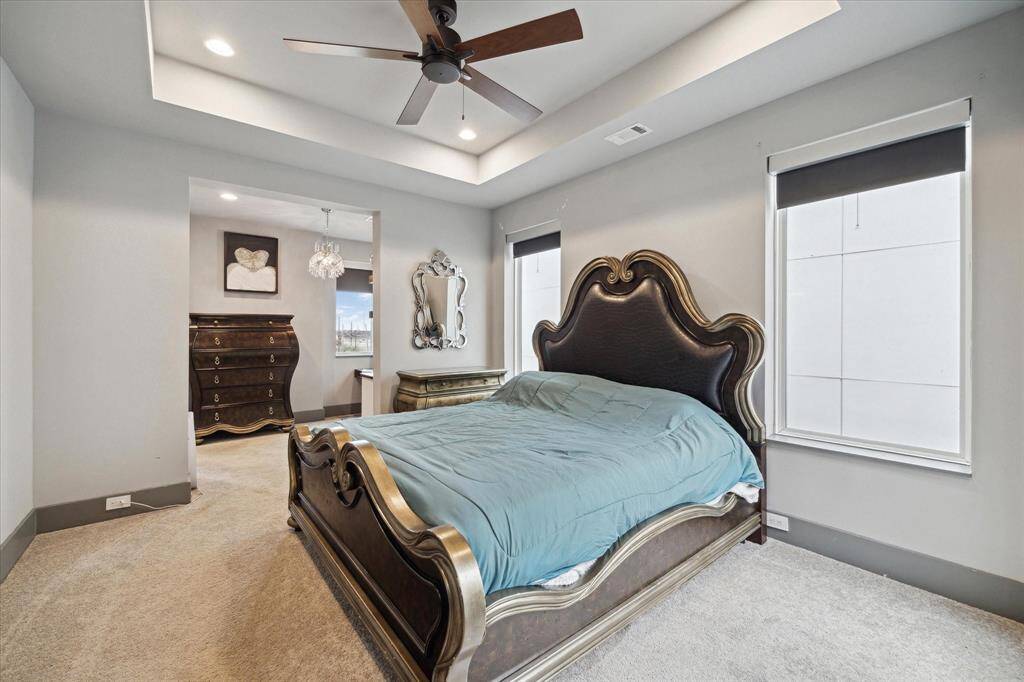 Spacious primary suite (3rd floor) with vaulted ceilings and sitting area.