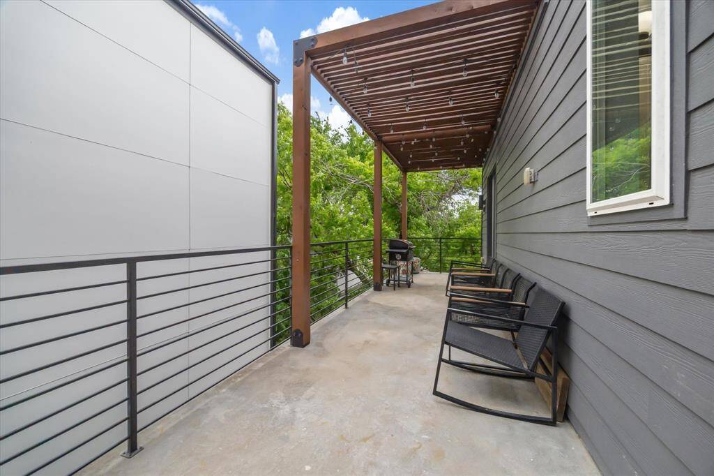 Private terrace (3rd floor) off of the primary suite w/ pergola.