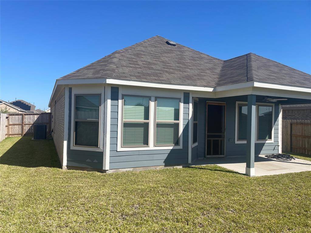 Rear Covered Patio and Lawn to enjoy Texas Breeze.