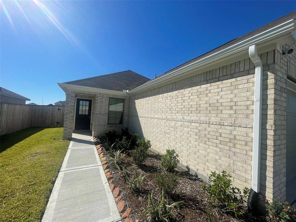 Walkway goes to your Front Entry Door with small covered Porch.