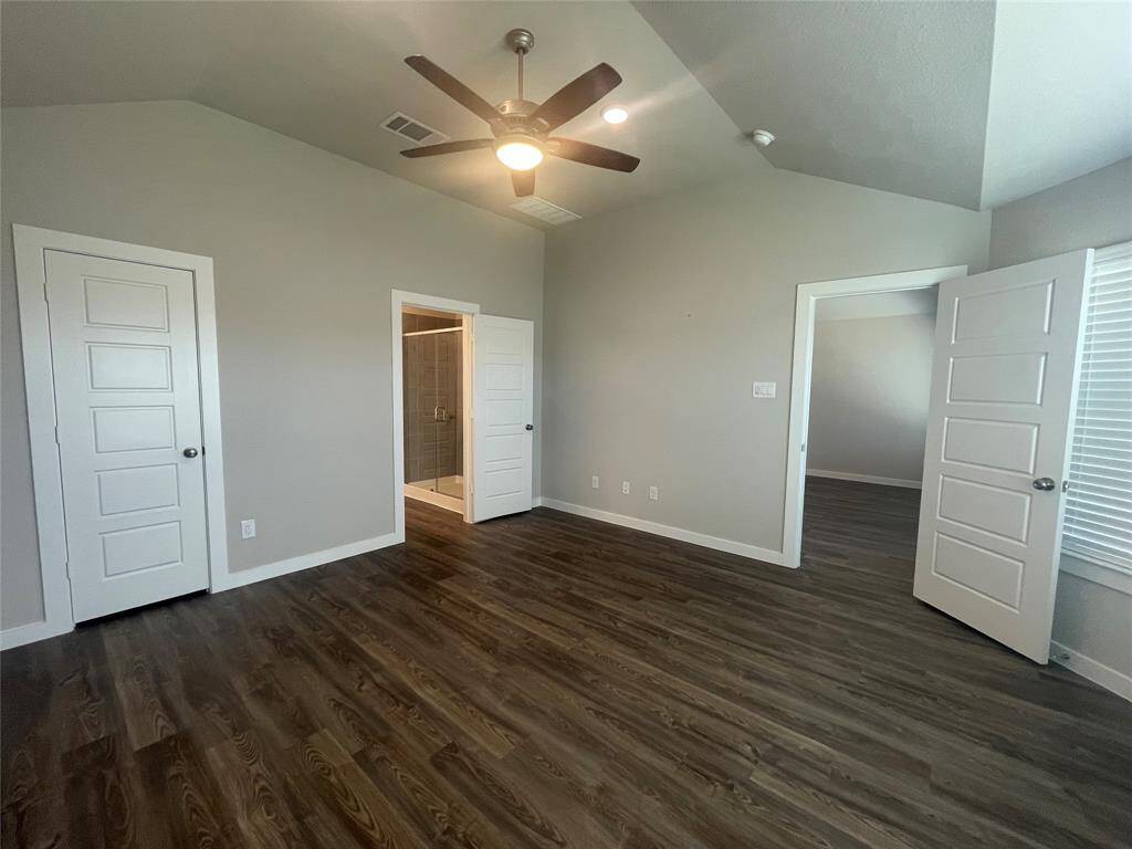 Primary Bedroom with Ceiling Fan and light Combo.