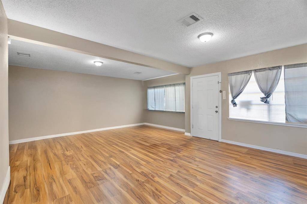 View from the dining/kitchen area to the large living space