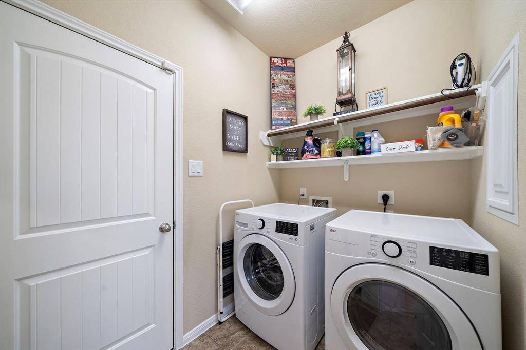 Laundry Room with new shelving with access to the Garage