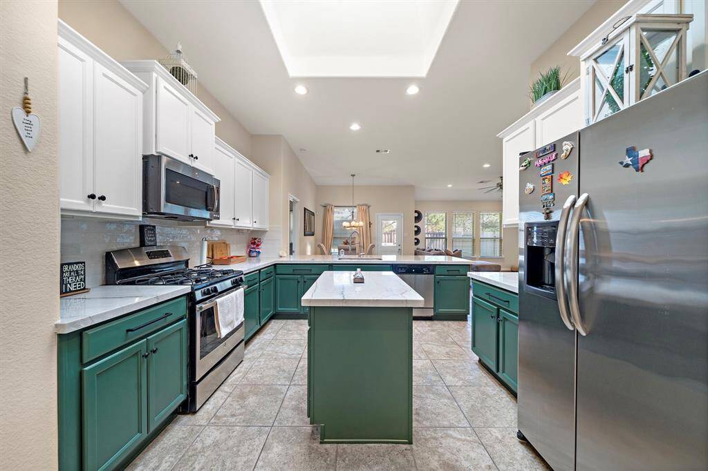 Kitchen - Recently renovated with Quartzite countertops, newly painted cabinets and hardware, sink with 360-pot filler.