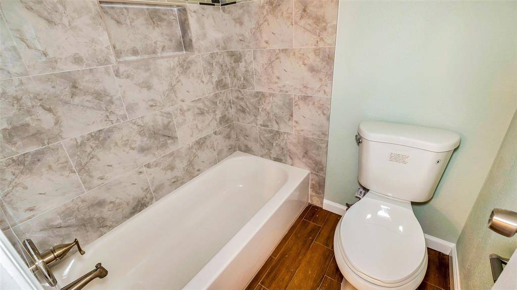 Surround Tile 2nd Bath Tub and shower and commode
