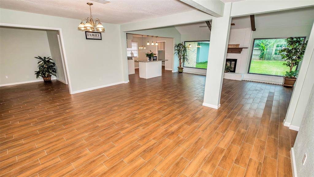 Woodlike Tile opens up the house with Dining/Formal Living on the left side to entry way.