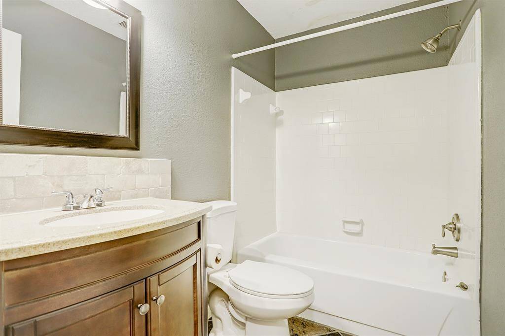 Second bathroom has updated shower/tub combo and beautiful vanity.