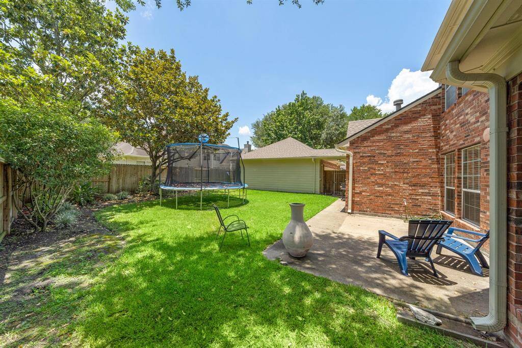 Backyard patio and green space.